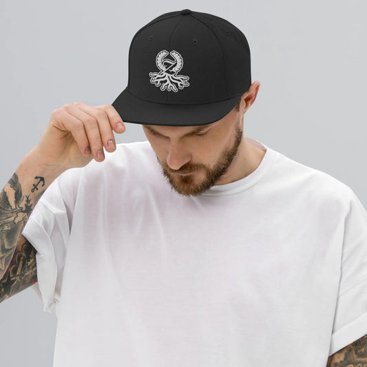 Man wearing black embroidered Zaylachi Origine snapback streetwear cap | Zaylachi Co.