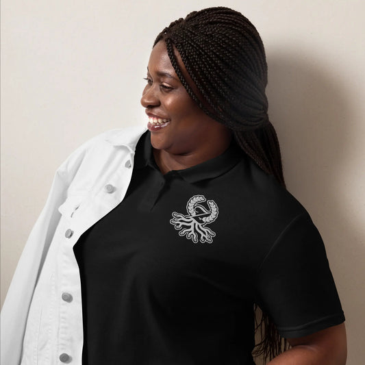Woman wearing black semi-fitted Zaylachi Origine pique polo lifestyle | Zaylachi Co.